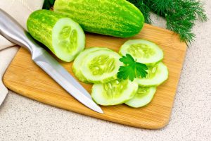 Cucumber with parsley on granite table