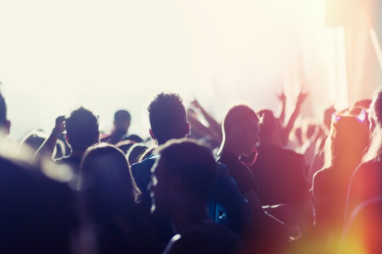People dancing and cheering at festival